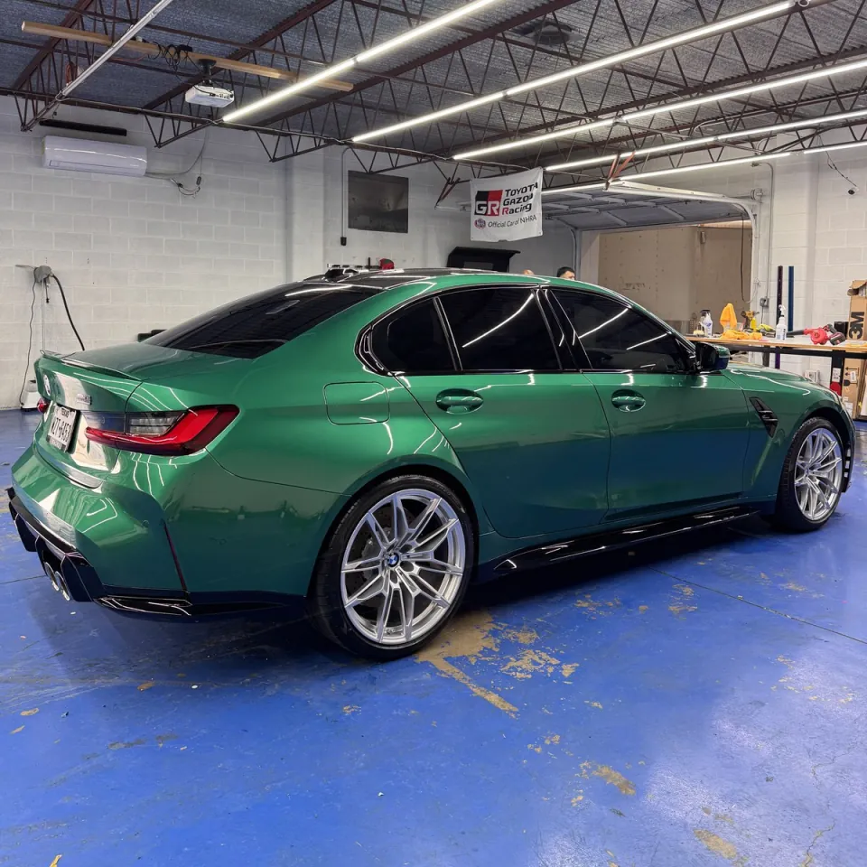 British Racing Green BMW M3 ceramic coated and ceramic tinted in San Antonio by ShineLab