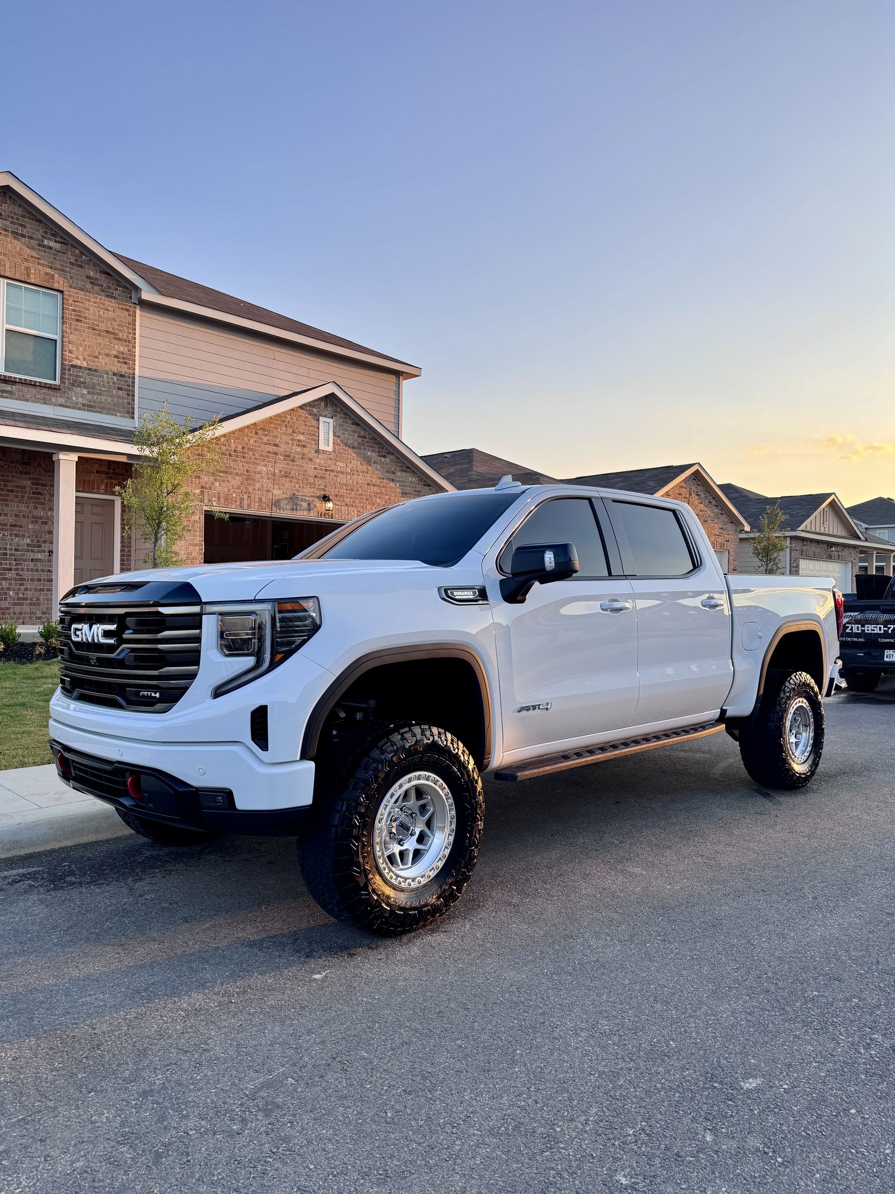 White GMC Sierra Denali at golden hour, ShineLab San Antonio